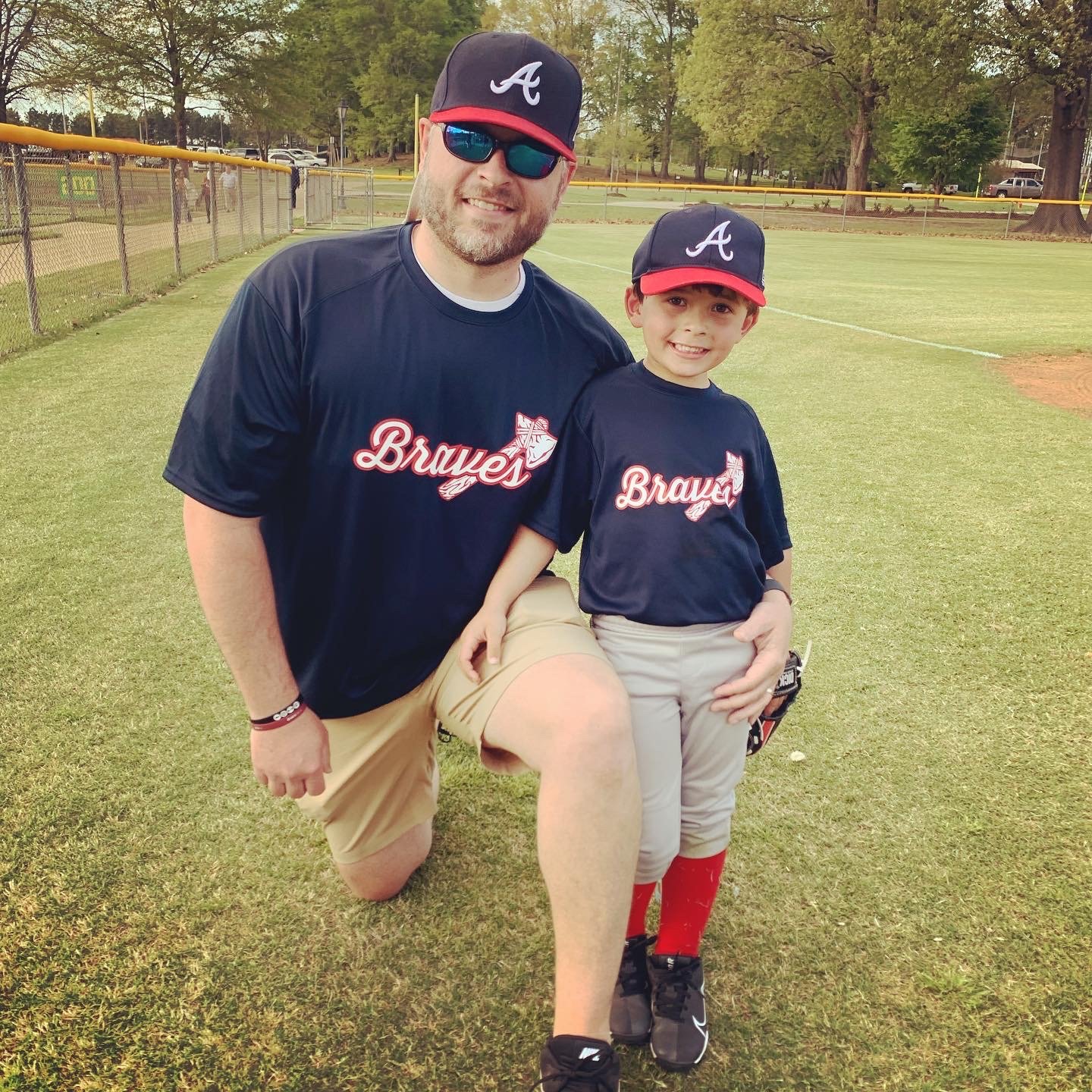 Austin Cooley of Madison poses with his son Jackson Cooley before a Madison Ridgeland Youth Club baseball league game.